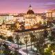 Pasadena City Hall and surrounding buildings illuminated at dusk.